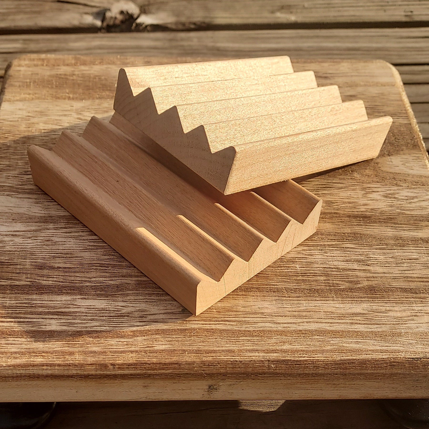 Wooden Soap Saver with ridges on a wooden display board 